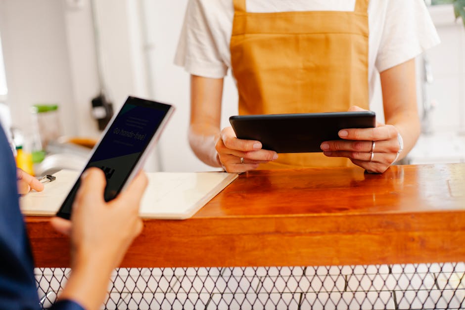Small business owner reviewing operations on a tablet